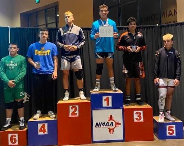 Photo of Estevan Sierra at the top of the podium